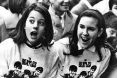 Fans await the arrival of the Beatles in New York. February 10, 1964.