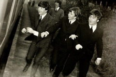 George Harrison, Paul McCartney, Richard Starkey, and John Lennon (boots on the run)
