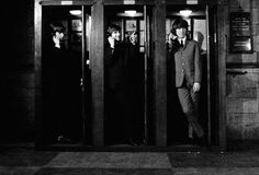 In telephone booths; the opening scene for the film A Hard Day's Night - The Beatles