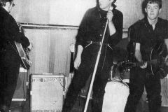 1960, May 10, Stuart Sutcliffe, John Lennon and Paul McCartney during an audition for Larry Parnes at the Wyvern Social Club, 108 Seel Street, Liverpool.