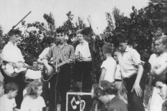 1957, July 6, The Quarrymen perform at the Woolton Parish Church Fete. From left to right Eric Griffiths, Colin Hanton, Rod Davis, John Lennon, Pete Shotton, Len Garry