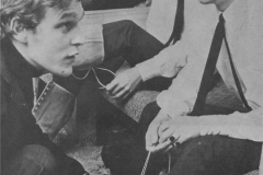 Neil Aspinall helps Ringo with his boot during the 1964-1965 Christmas show.