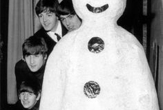 The Beatles meet a snowman at the Finsbury Park Astoria, London, where they are rehearsing for the Christmas Show. December, 1963. S)