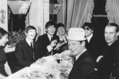 Celebrating I Want to Hold Your Hand being number 1 in the US with Judy Martin, Brian Epstein, and George Martin.