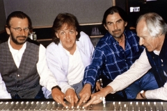 Ringo Starr (left to right), Paul McCartney, George Harrison and producer George Martin Photo
