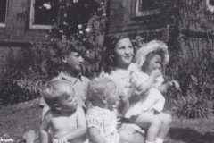 29- John Lennon and his cousins in Nanny's garden in the summer of 1949. Back r