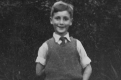 47-Look at his mischievous little self. Probably has a frog or something behind his back