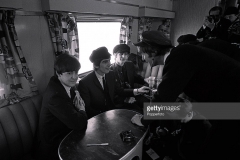 All kinds of funny things happened on the train. They were behaving for the camera. Ringo carried some camera bags and worked his way through the coach