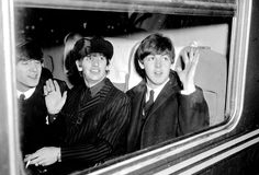 FEBRUARY 11, 1964 Beatles John Lennon, Ringo Starr and Paul McCartney aboard train.