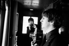 George and Ringo with their cameras on the train, February 11, 1964