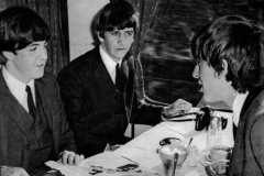 Paul, Ringo and George on the train