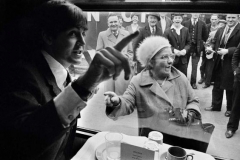 G.B. ENGLAND. LONDON. The BEATLES during filming of 'A Hard Days Night'. The Beatles film was primarily shot on a moving train. Fan recognising Paul McCartney. 1964.