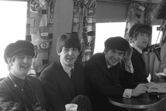 The Beatles on the train back from Washington DC, 12 February 1964. Photo by