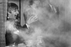 The Beatles on the train to South Molton, Devon in their special train for the filming of "A Hard Day's Night". Ringo Starr with a cine camera. 5 March 1964.