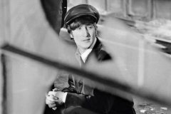 ohn Lennon on train platform. 1964.