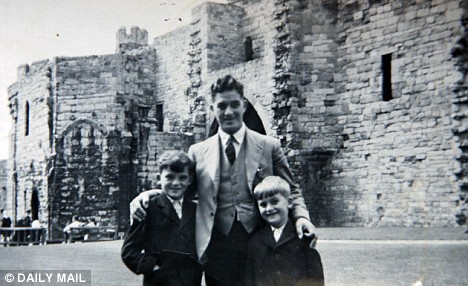 George, aged six, with his father and brother Peter, nine