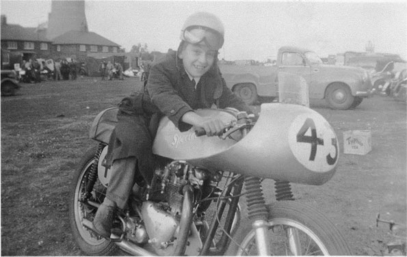 George at the age of 12 at Aintree, Liverpool, "Sir, may I sit on your bike?"