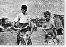 Pete Harrison (left) and George Harrison, one year later, on their bicycles.