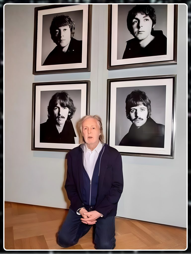 Sir Paul McCartney kneels before the timeless images of The Beatles