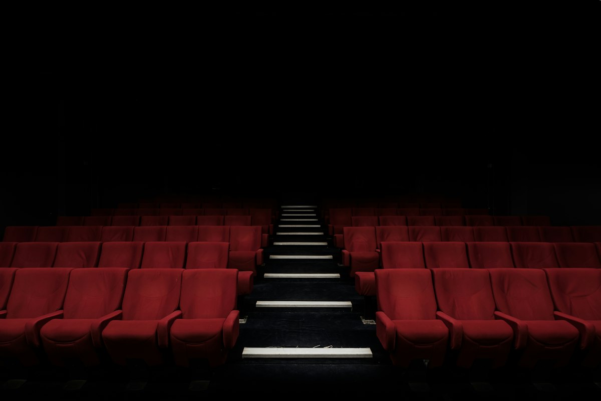 Cinematic cinema screen showcasing the 4K restoration of The Beatles 1970 Let It Be documentary